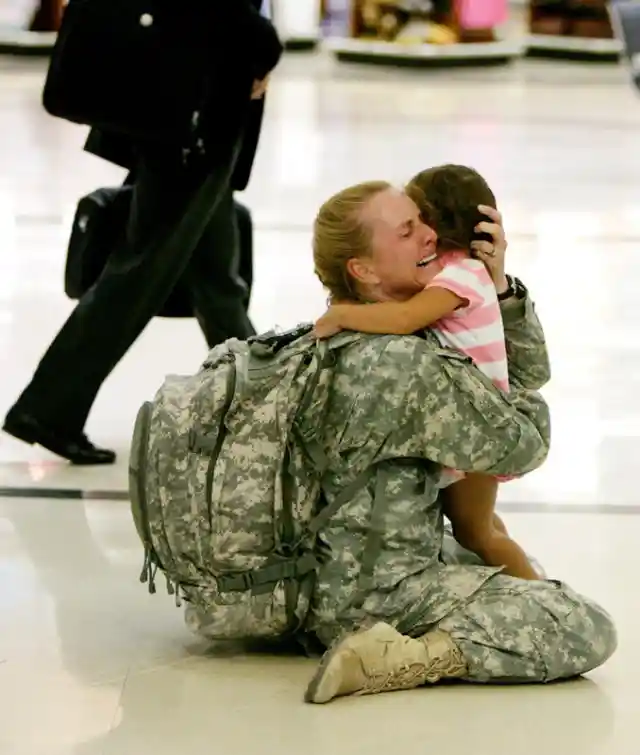 Terri Gurrola hugs her daughter at the airport after serving seven months in Iraq