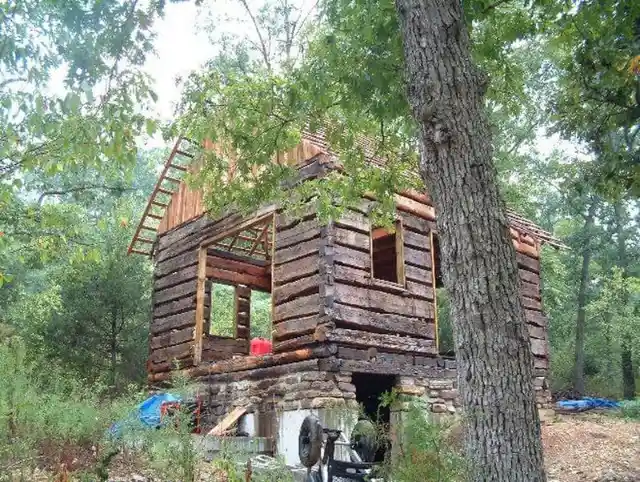 They poured the basement floor with concrete, and though it pained Richard to get materials from living trees, he decided that it would be worth it. Other changes included the use of white oak to form new floor joists, and split cedar shakes as shingles. A rustic front porch was also added to the cabin.