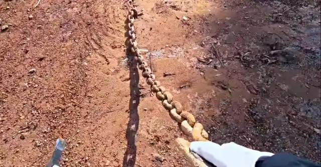 Man Finds Old Buried Chain, Then Gut Tells Him To Keep Pulling