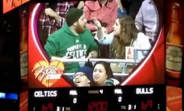 Arguing couple caught on kiss cam