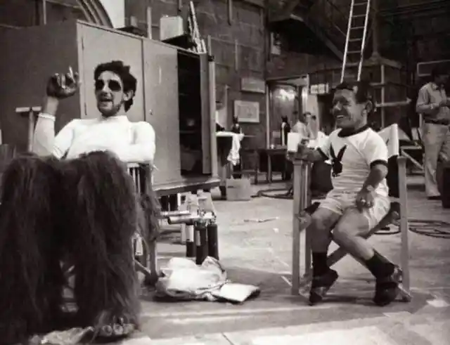 The actors behind Chewbacca and R2D2 take a break onset.
