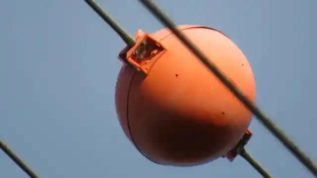 Have You Seen These Red Balls On Power Lines? Here Is What They Are Really For 