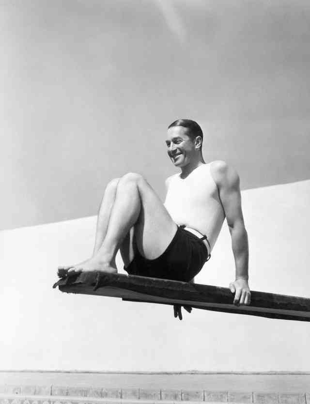 Singer Maurice Chevalie Sitting on a Diving Board