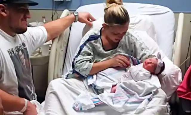 Woman Who Just Had A Baby Looks Under The Newborn Blanket And Starts Crying