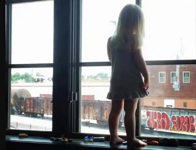 Little Girl At The Window