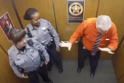This Cop Doesn't Realize Hidden Camera Is Recording Him In The Elevator