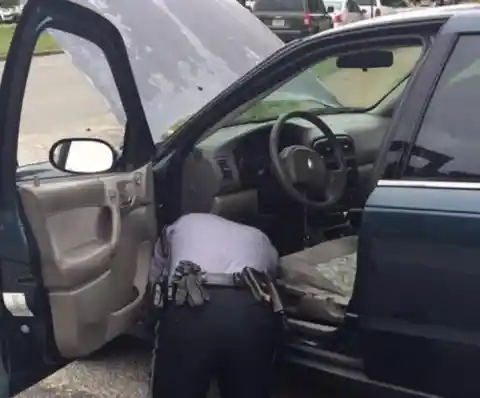 Police Officer Opens Woman's Trunk, Looks Inside And Jumps