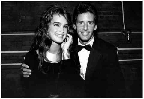 Here is a young Brooke Shields appearing smitten with clothing designer Calvin Klein.