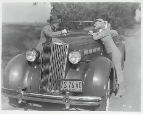 Hollywood Couple Leaning on Packard in California