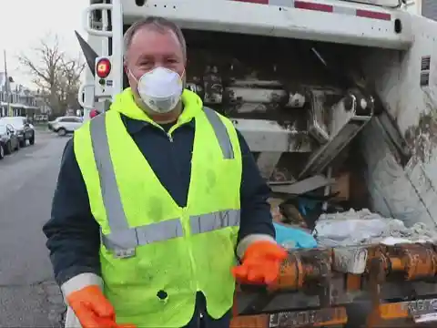 Garbage Truck Worker Sees Trash Bag Moving In The Road, Opens It And Jumps