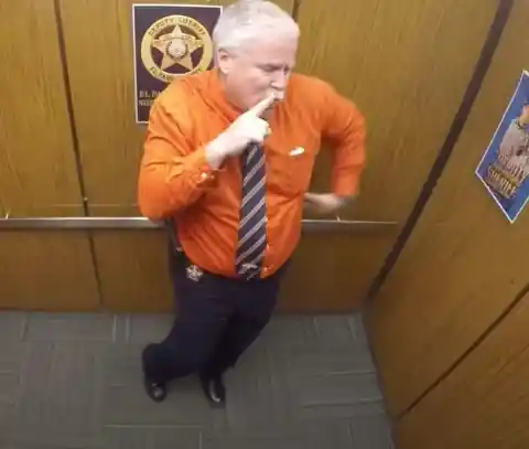This Cop Doesn't Realize Hidden Camera Is Recording Him In The Elevator