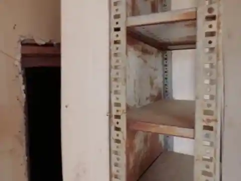 A Doorway Hidden Behind the Shelves