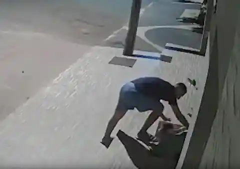 Surveillance Camera Captures Man's Gesture On The Street, It Goes Viral