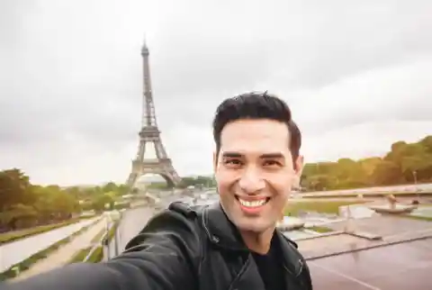 Garry would rather send selfies than text you. His latest is in front of the Eiffel tower. What will you say?