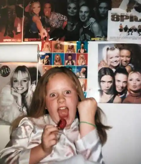 Adele in Front of Spice Girls Posters