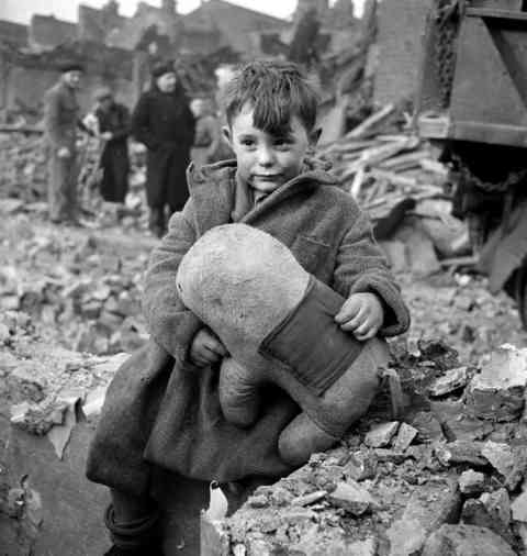 Abandoned Boy Holding a Stuffed Toy Animal. London 1945